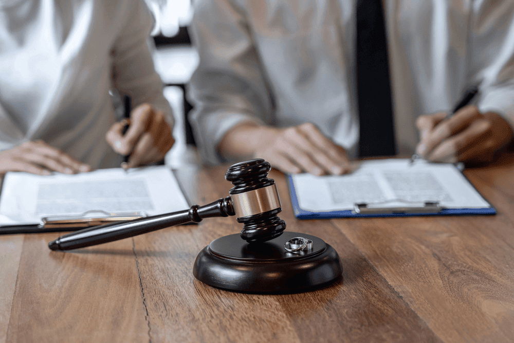 Couple Signing Family Law Templates To Finalise Divorce